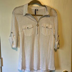 Very cute white top with zipper in front and buttoned sleeves, in a large.
